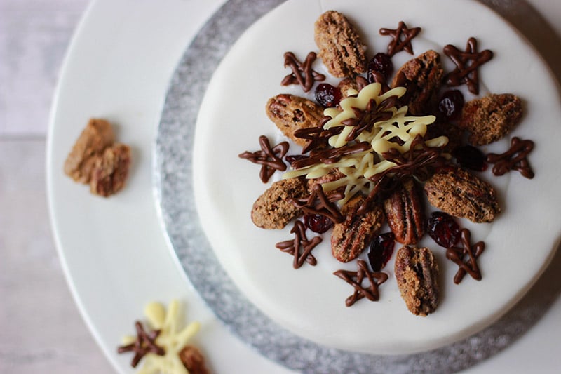 properfoodie christmas cake with chocolate decor and sugared pecans