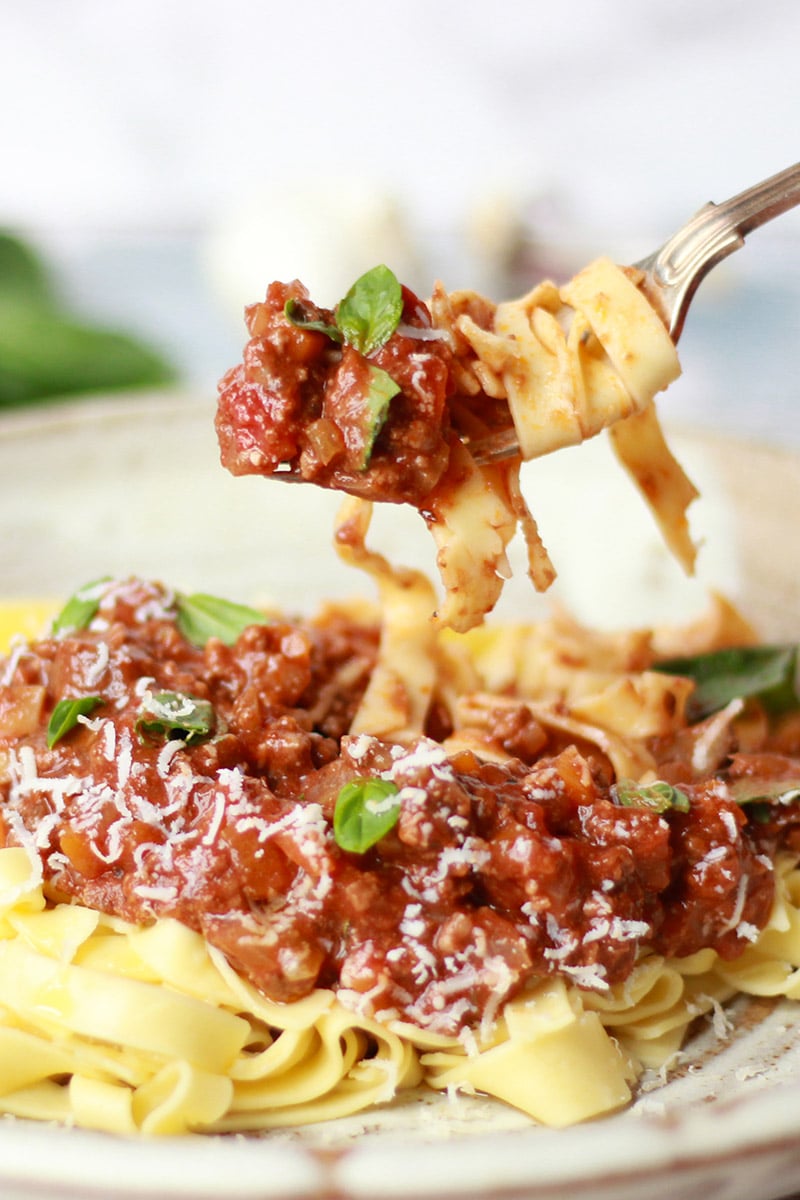 A lusciously, rich and tomatoey slow cooker Ragu, served with a mound ...