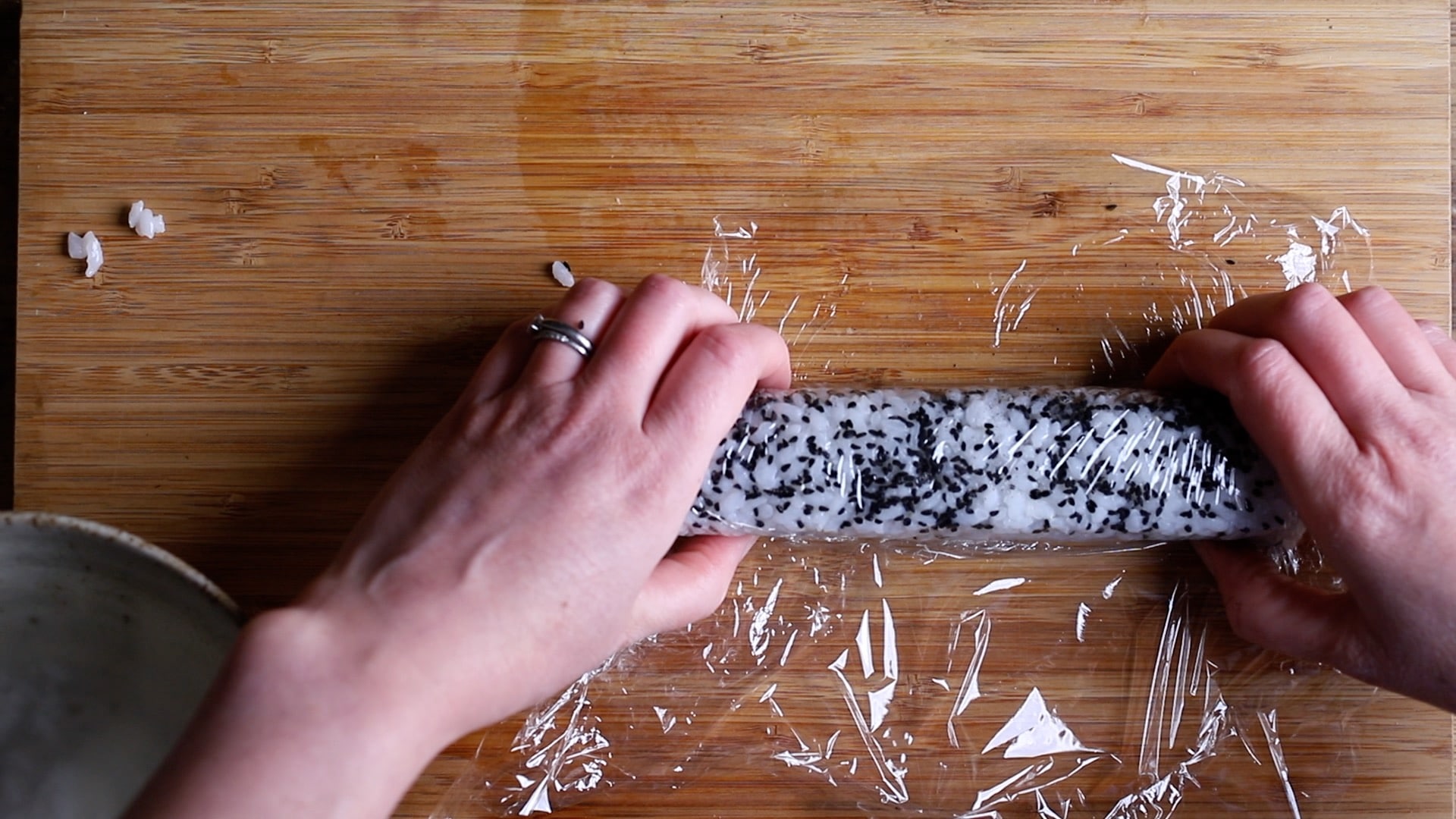 cover the california roll with cling film before slicing