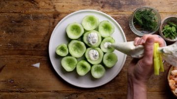 fill cucumber cups with yogurt sauce