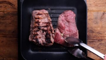 frying steaks in griddle pan