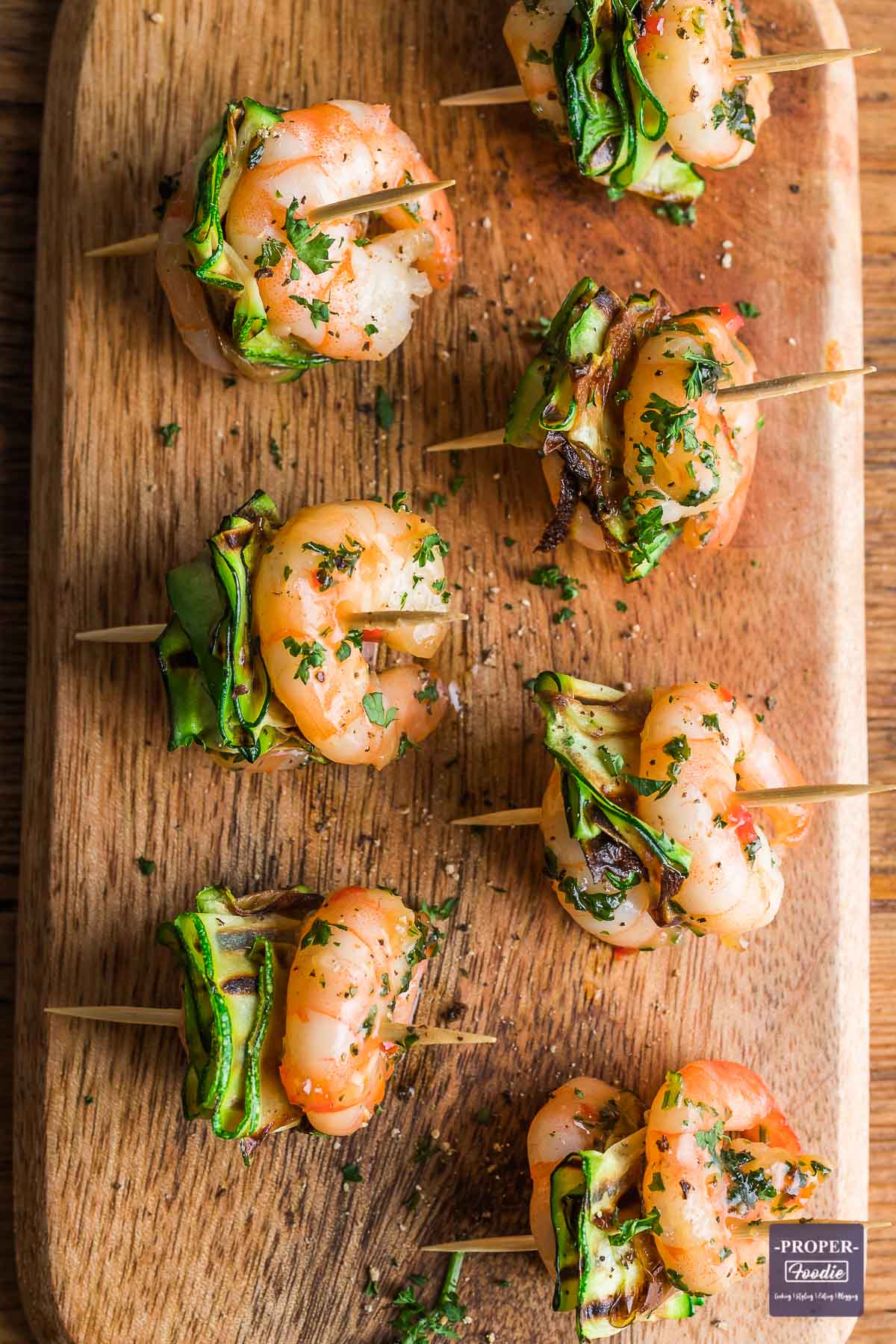 Honey, chilli and garlic king prawns skewered on cocktail sticks with pan fried courgette.