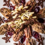 Christmas cake decoration of sugared pecans and chocolate stars